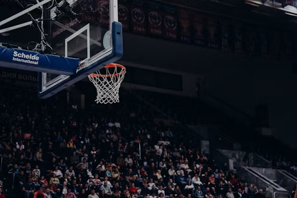 NBA player dribbling down the court